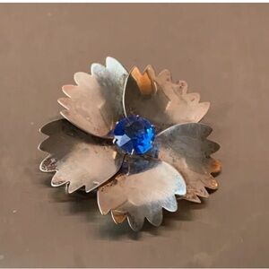 Rose gold Vermile flower brooch by Jordan